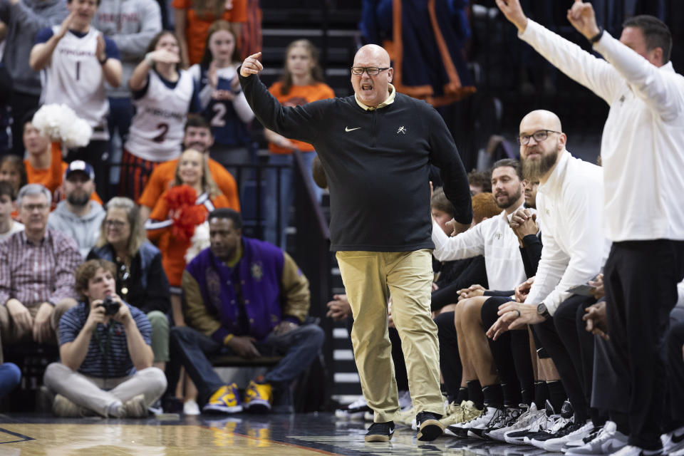 Wake Forest head coach Steve Forbes directs his players during the first half of an NCAA college basketball game against Virginia, Saturday, Feb. 17, 2024 in Charlottesville, Va. (AP Photo/Mike Kropf)