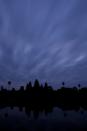 Angkor Wat, the most famous temple in the Angkor Archeological Park, seen against a painted December sky in Siem Reap, Cambodia.