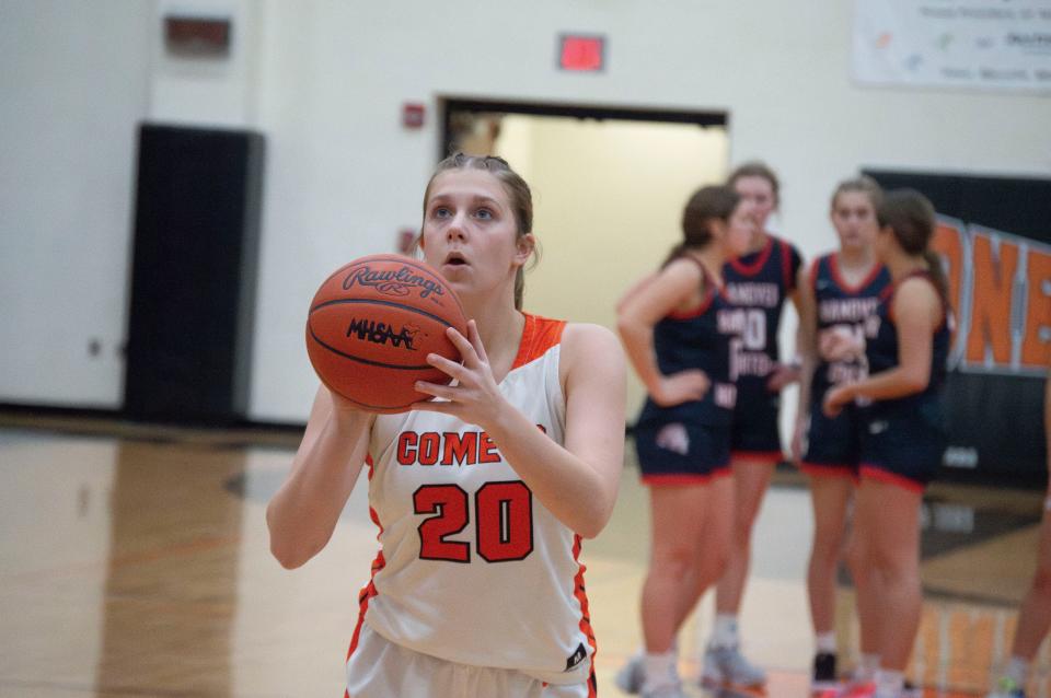 Junior Korra Estel (20) hit the dagger triple from right at the 3-point line to keep the Comets alive in overtime. The Comets eventually beat East Jackson 54-46.