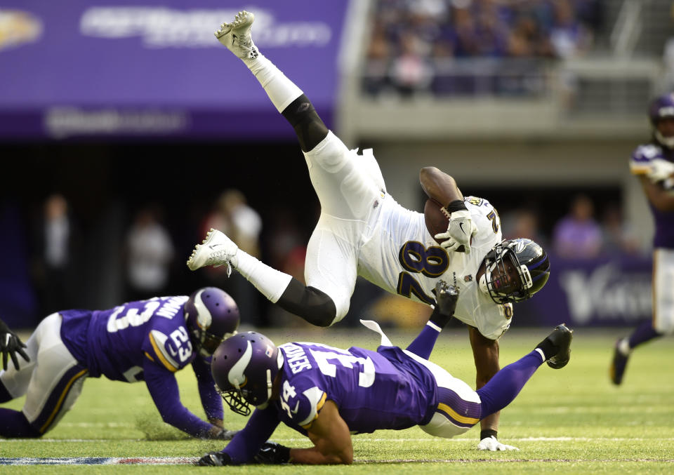 <p>Benjamin Watson #82 of the Baltimore Ravens is upended by Andrew Sendejo #34 of the Minnesota Vikings in the second quarter of the game on October 22, 2017 at U.S. Bank Stadium in Minneapolis, Minnesota. (Photo by Hannah Foslien/Getty Images) </p>