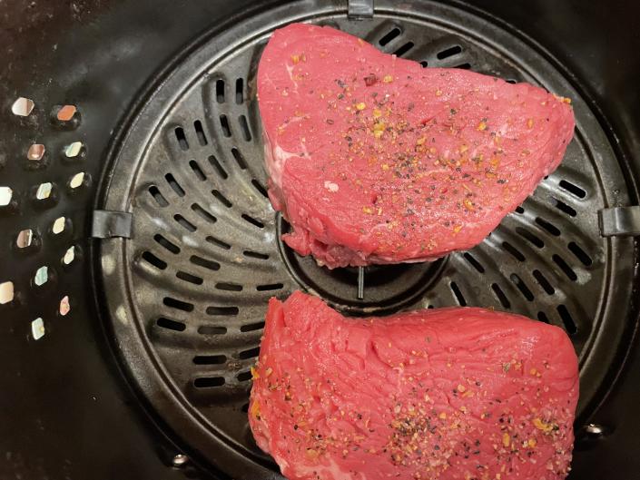 When cooking filet mignon in an air fryer, it's important to be sure the steaks do not touch each other or the walls of the appliance. (Photo: Suzanne Hayes)