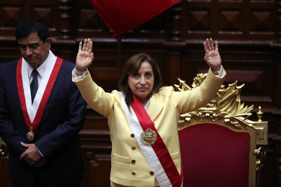 Former Vice President Dina Boluarte acknowledges lawmakers after she was sworn in as president at Congress in Lima, Peru, Wednesday, Dec. 7, 2022. Behind is Congress President Jose Williams. Peru's Congress voted to removePresident Pedro Castillofrom office Wednesday and replace him with the vice president, shortly after Castillo tried to dissolve the legislature ahead of a scheduled vote to remove him. (AP Photo/Guadalupe Pardo)