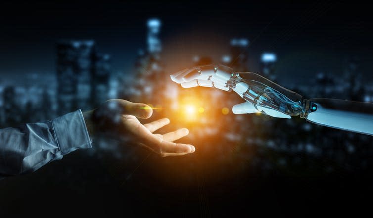 <span class="caption">Governments could encourage the integration of human and artificial intelligence.</span> <span class="attribution"><a class="link " href="https://www.shutterstock.com/image-photo/white-cyborg-hand-about-touch-human-1106072312?src=LTmhm804VkO5OMax_0W5mg-1-1" rel="nofollow noopener" target="_blank" data-ylk="slk:sdecoret/Shutterstock;elm:context_link;itc:0;sec:content-canvas">sdecoret/Shutterstock</a></span>