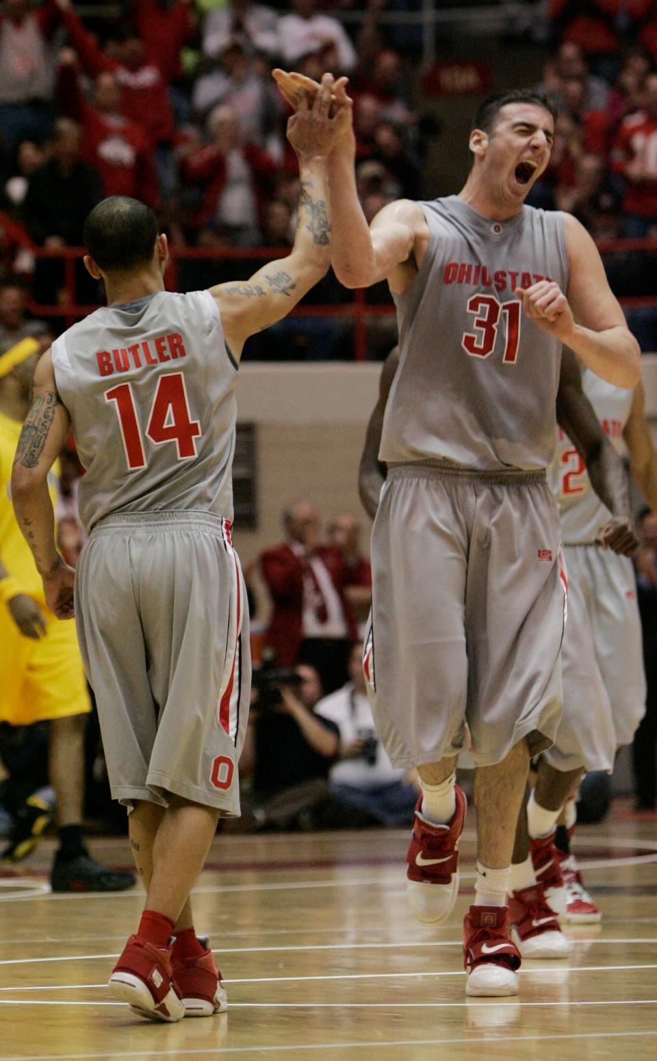 (NCL_NIT25_LAURON 24MAR08) Ohio State's Kosta Koufos, 31, celebrates teammate's Jamar Butler's 14, three pointer in the second half against California NIT game at St. John Arena, March 24, 2008. Butler hit made 4 for 9 three point shots. (Dispatch photo by Neal C. Lauron)