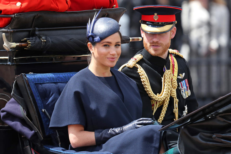 Prince Harry and Meghan Markle in a carriage.