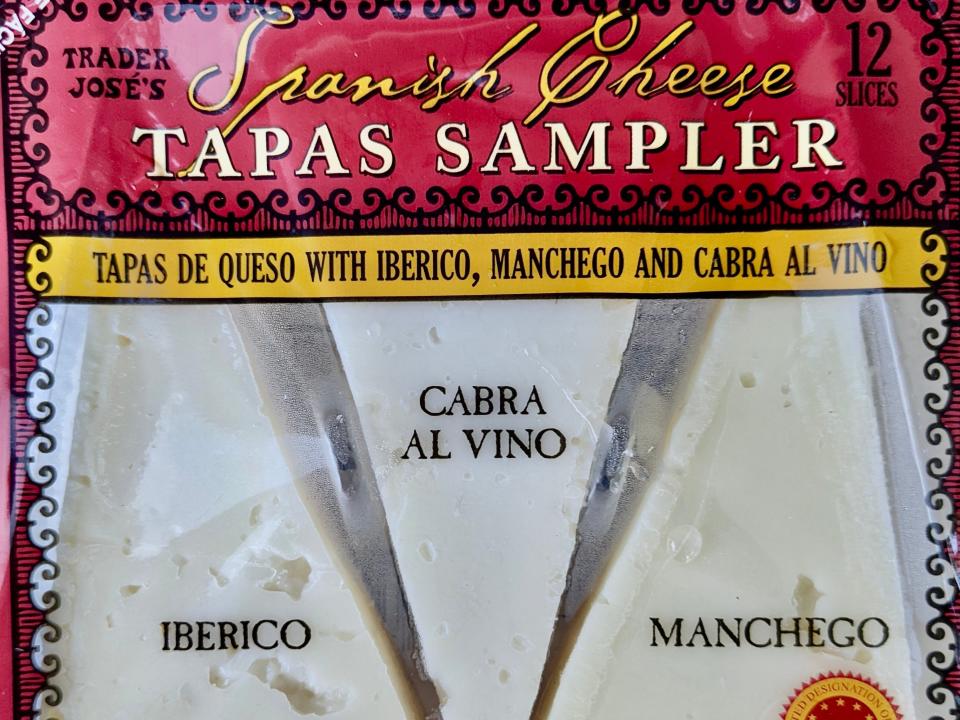 closeup shot of the trader joe's spanish cheese tapas sampler pack with three wedges of cheese