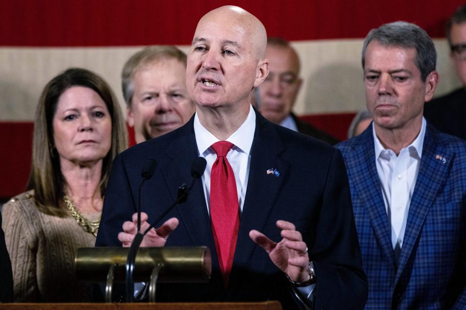 Former Nebraska Gov. Pete Ricketts discusses his appointment to the U.S. Senate by Nebraska Gov. Jim Pillen, right, in the Governor's Hearing Room on Thursday. The vacancy was created by the departure of Sen. Ben Sasse. (Chris Machian/Omaha World-Herald via AP)