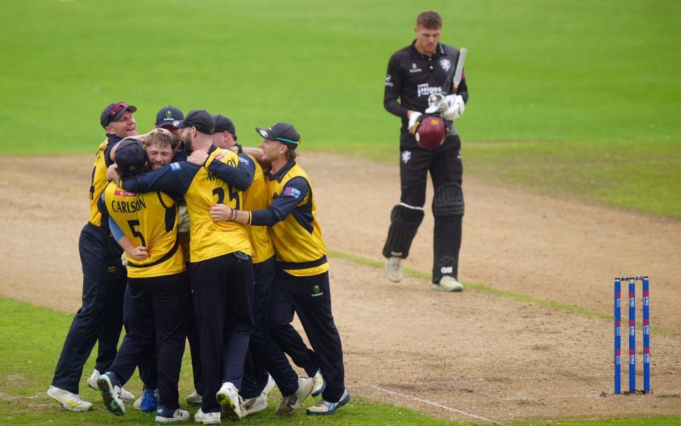 Glamorgan's players hug as they celebrate winning the Metro Bank One-Day Cup final at Trent Bridge - Glamorgan win 50-over cup after beating Somerset in shortened game