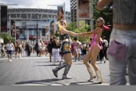 Taylor Swift fans pose for a picture outside Wembley Stadium before the first London concert of the Eras Tour on Friday, June 21, 2024 in London. (Photo by Scott A Garfitt/Invision/AP)