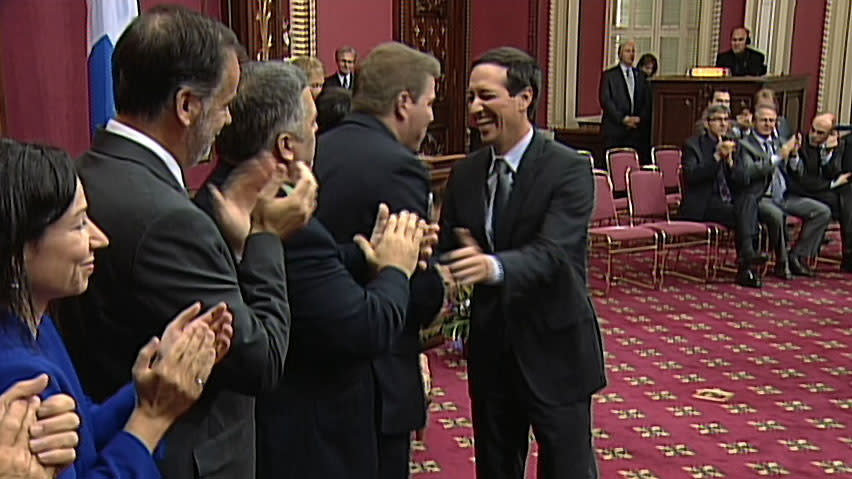 Freshly appointed Treasury Board President Stéphane Bédard, right, shakes hands with cabinet colleagues, from right, Pascal Bérubé (tourism), Daniel Breton (environment), Pierre Duchesne (higher education) and Martine Ouellet (natural resources). Quebec's new cabinet has 23 ministers plus Premier Pauline Marois.