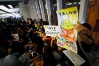 Protest at Yuen Long MTR station, the scene of an attack by suspected triad gang members a month ago