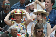 Spectators watch Spain's Rafael Nadal play Portugal's Joao Sousa in a Men's singles match during day seven of the Wimbledon Tennis Championships in London, Monday, July 8, 2019. (AP Photo/Alastair Grant)