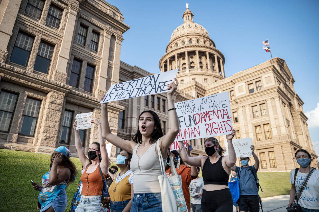 AUSTIN, TX - SEPT 1: Pro-choice protesters march outside the Texas State Capitol on Wednesday, Sept. 1, 2021 in Austin, TX. Texas passed SB8 which effectively bans nearly all abortions and it went into effect Sept. 1. A request to the Supreme Court to block the bill went unanswered and the Court still has yet to take any action on it. (Sergio Flores For The Washington Post via Getty Images)