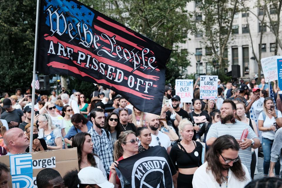 People march against COVID-19 mandates at a rally Sept. 13 in New York City.