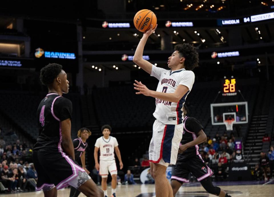 Modesto Christian’s Myles Jones attempts a pull jump shot during the Sac-Joaquin Section Division I championship game with Lincoln of Stockton at the the Golden 1 Center in Sacramento, Calif., Wednesday, Feb. 21, 2024.