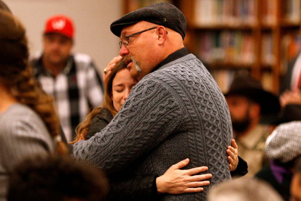 Pastor Frank Pomeroy hugs a woman during a visit with family and victims of the shooting at First Baptist Church in Sutherland Springs, Texas. (Photo: Jonathan Bachman/Reuters)