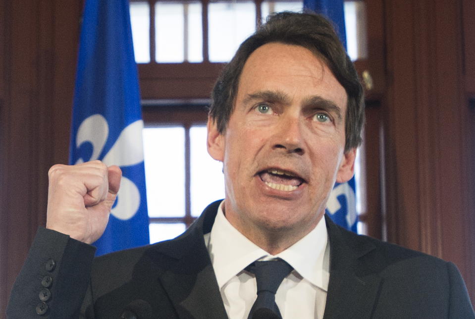 Pierre Karl Peladeau gestures during a press conference in Saint Jerome, Quebec, Sunday, March 9, 2014. Peladeau has announced his candidacy for the riding of Saint Jerome for the Parti Quebecois on day five of the Quebec provincial election campaign. (AP Photo/The Canadian Press, Graham Hughes)