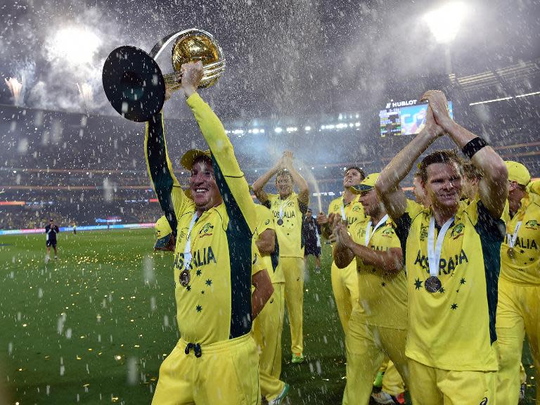 Australian wicketkeeper Brad haddin (L) celebrates his team's victory after winning the Cricket World Cup final against New Zealand in Melbourne on March 29, 2015