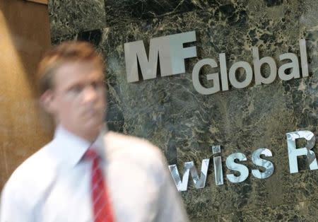 A man exits the office complex where MF Global Holdings Ltd have an office on 52nd Street in midtown Manhattan New York, October 31, 2011. REUTERS/Brendan McDermid