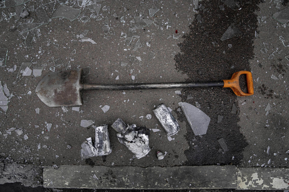 Parts of a rocket lie on the ground after a Russian attack at Barabashovo market in Kharkiv, Ukraine, Thursday, July 21, 2022. (AP Photo/Evgeniy Maloletka)