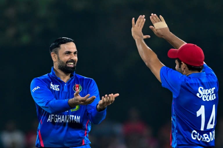 Mohammad Nabi (L) starred with bat and ball for Afghanistan in the third ODI against <a class="link " href="https://sports.yahoo.com/soccer/teams/republic-of-ireland-women/" data-i13n="sec:content-canvas;subsec:anchor_text;elm:context_link" data-ylk="slk:Ireland;sec:content-canvas;subsec:anchor_text;elm:context_link;itc:0">Ireland</a> (Ishara S. KODIKARA)