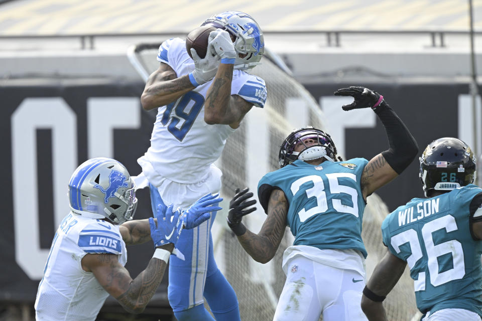 Detroit Lions wide receiver Kenny Golladay (19) makes a reception in front of Jacksonville Jaguars cornerback Sidney Jones (35) during the second half of an NFL football game, Sunday, Oct. 18, 2020, in Jacksonville, Fla. (AP Photo/Phelan M. Ebenhack)