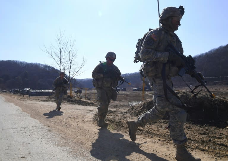 US soldiers patrol during their drill at a military training field in the border city of Paju on March 7, 2017