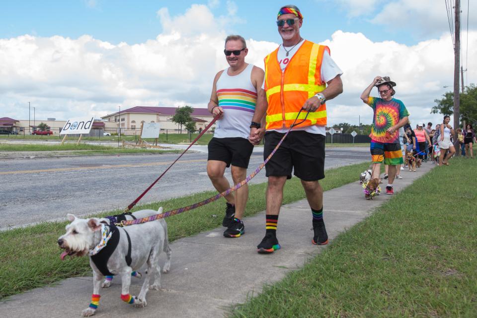 Pride Corpus Christi held its first Pride Pet Paw-rade Saturday, June 12, 2021. Brad Snyder (left) and his husband Tom Tagliabue, president of the Mosaic Project of South Texas, led the parade down Lipes Boulevard.