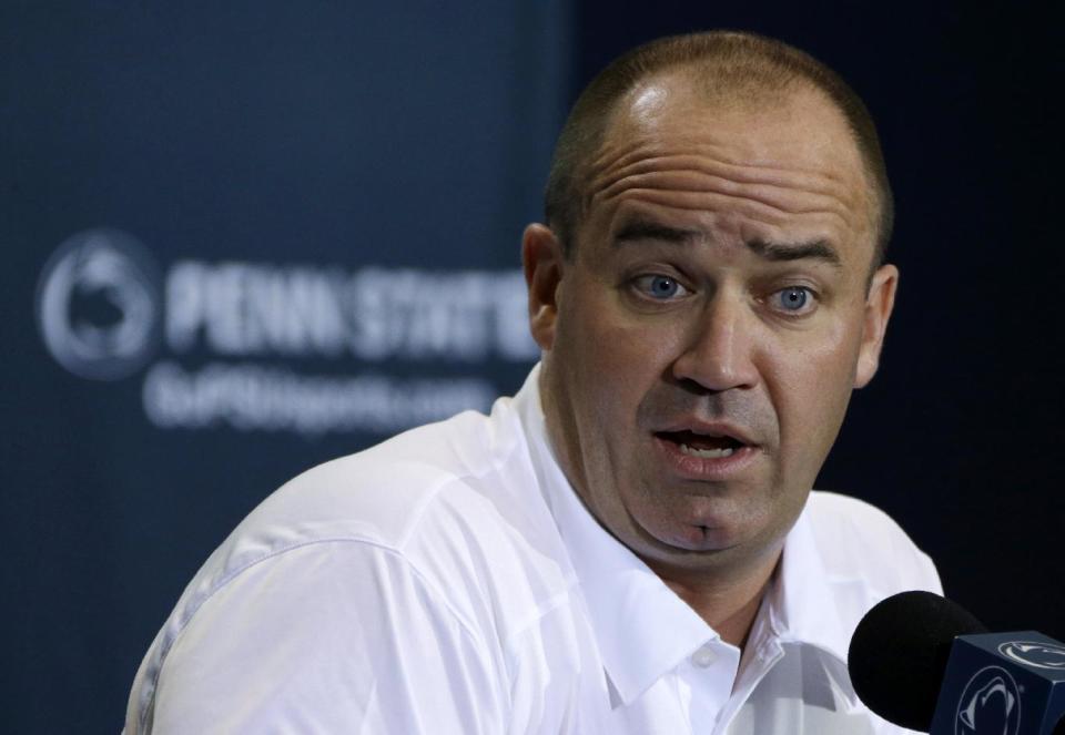 In this Aug. 8, 2013, photo, Penn State coach Bill O'Brien meets with reporters during the NCAA college football team's media day in State College, Pa. Two people familiar with the negotiations say O'Brien has reached an agreement to coach the Houston Texans. The people spoke to The Associated Press on the condition of anonymity because an official announcement hasn't been made. (AP Photo/Gene J. Puskar)