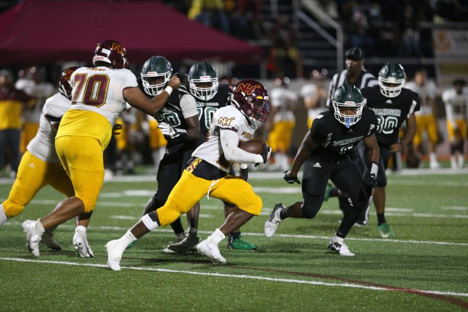 New Hampstead's Samari Dowdy turns the corner and finds an opening in the Windsor Forest defense as he races to the end zone for a touchdown during a Sept. 30 game at Memorial Stadium.