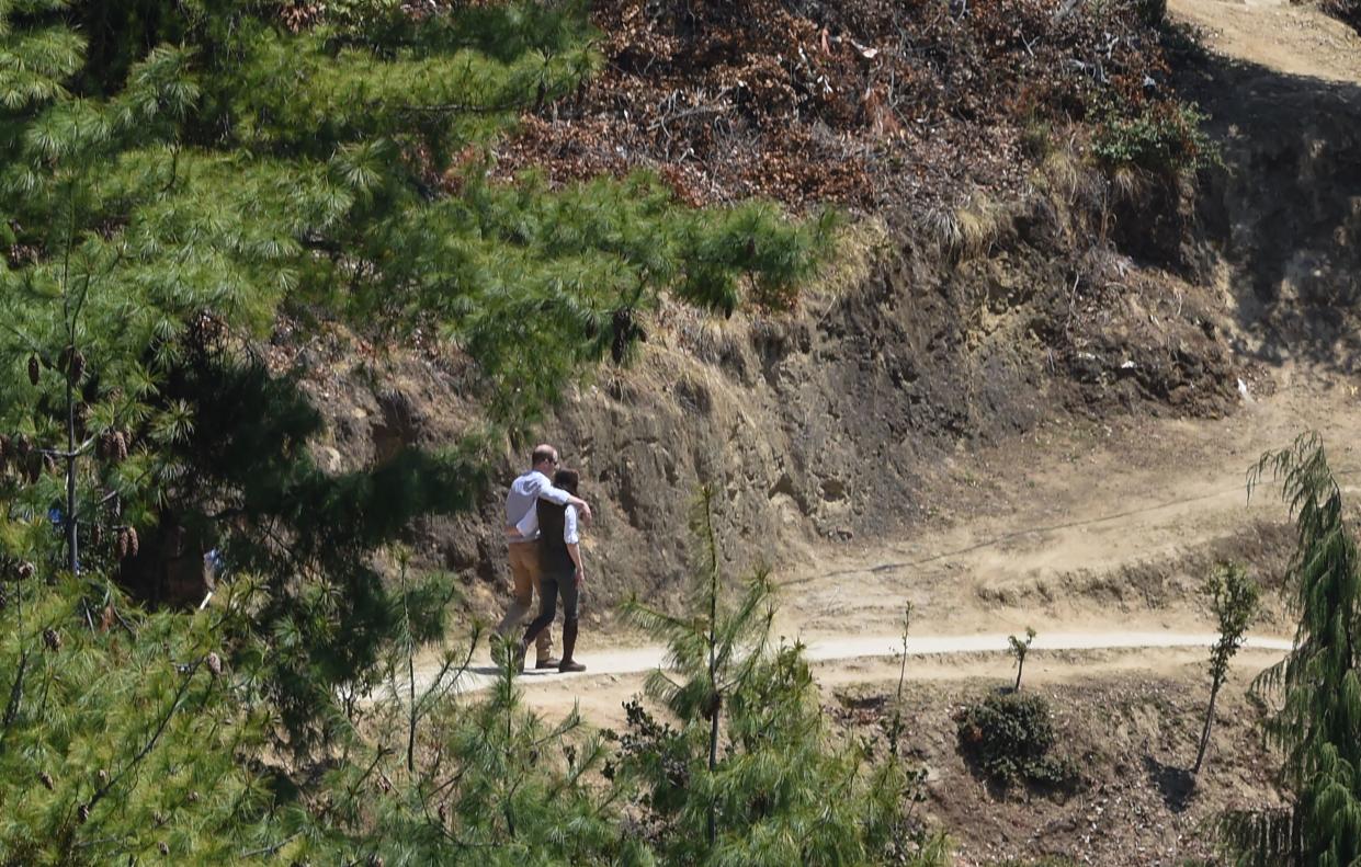 Kate and William enjoy a moment to themselves whilst trekking too a Buddhist monastery referred to as 'Tiger's Nest' or Paro Taktsang in 2016. (Getty Images)