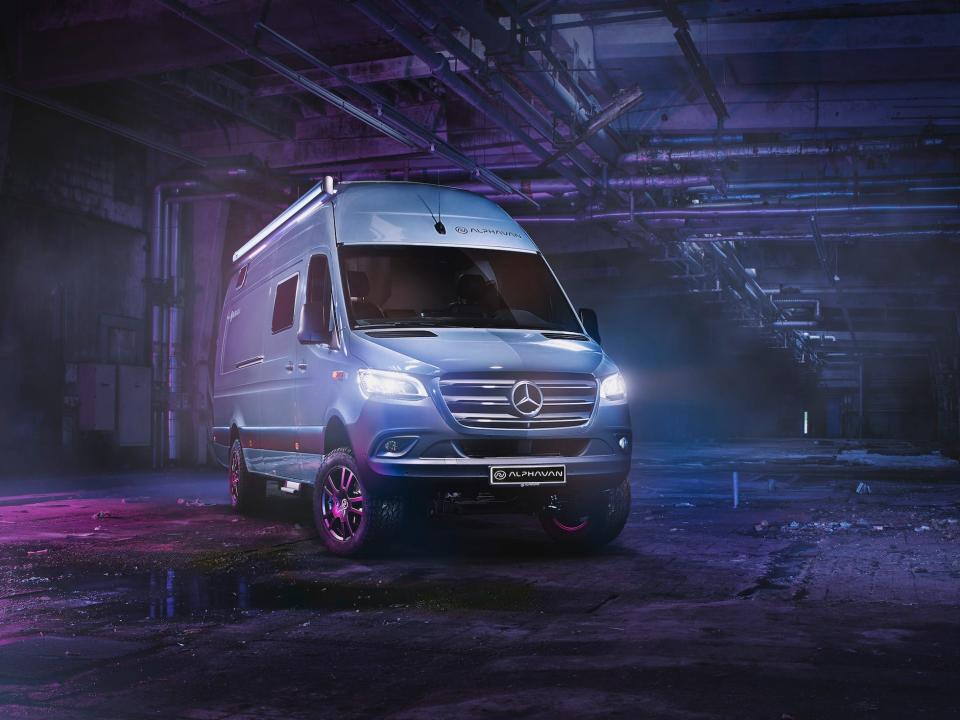 A rendering of the Alphavan in a purple and blue underground space.