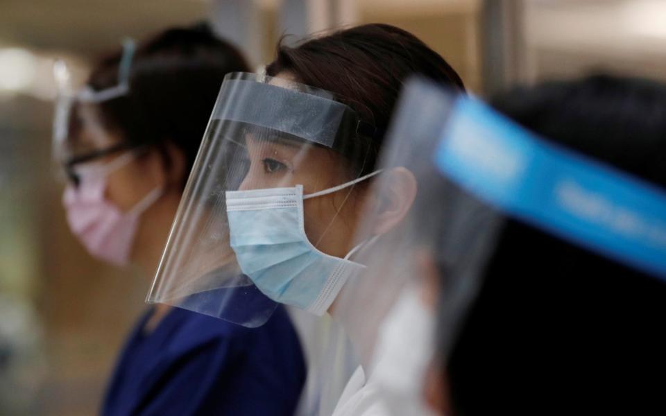 Hospital staff in Japan have had their bonuses cut despite the coronavirus outbreak - KIM KYUNG-HOON/REUTERS