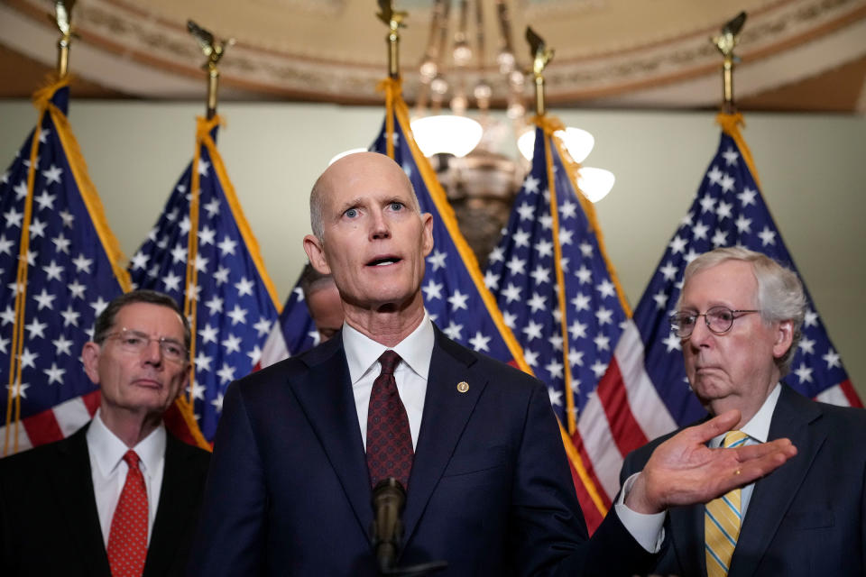 Flanked by Sen. John Barrasso and Senate Minority Leader Mitch McConnell, Sen. Rick Scott speaks during a news conference after a closed-door lunch with Senate Republicans at the Capitol on May 17, 2022.<span class="copyright">Drew Angerer—Getty Images</span>