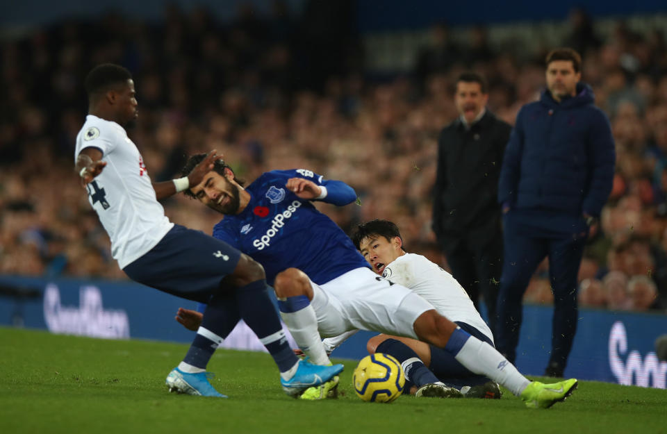 LIVERPOOL, ENGLAND - NOVEMBER 03: Son Heung-min of Tottenham Hotspur tackles Andre Gomes of Everton which resulted in a red card and Gomes suffering an injury during the Premier League match between Everton FC and Tottenham Hotspur at Goodison Park on November 3, 2019 in Liverpool, United Kingdom. (Photo by Robbie Jay Barratt - AMA/Getty Images)