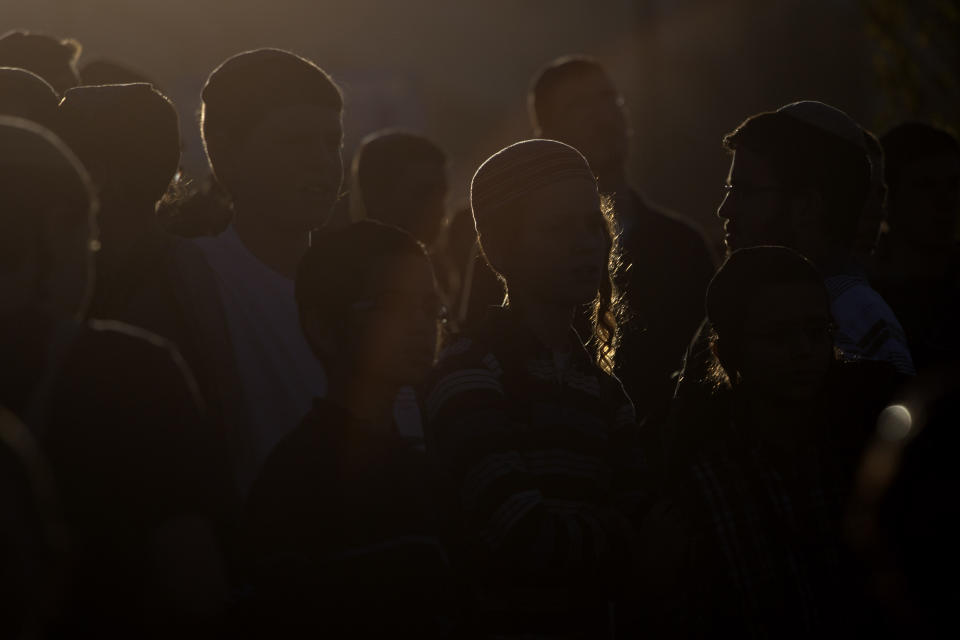 Israelis march from the West Bank settlement of Maaleh Adumim, to the E-1 area on the eastern outskirts of Jerusalem, Thursday, Feb. 13, 2014. Israel planned construction in the area E-1, or East 1, but froze under the international pressure in 2009. The construction in the area would effectively separate Palestinians in east Jerusalem from the West Bank. (AP Photo/Sebastian Scheiner)