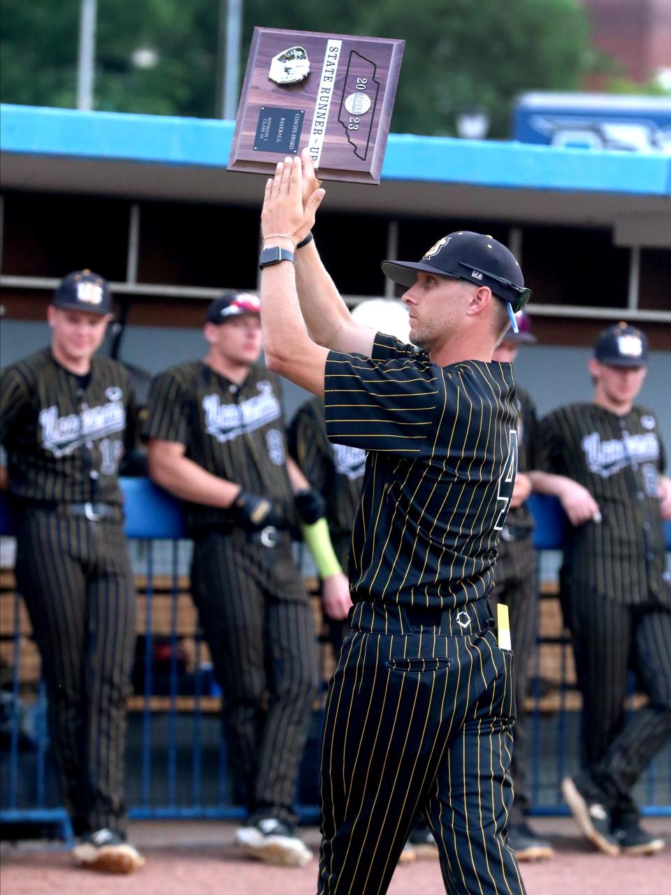 Upperman's head baseball coach Wes Shanks shows appreciation to the fans after receiving the Coach's Runner-Up trophy after losing to Greeneville during the 2023 TSSAA Class 3A State Baseball Championship at MTSU's Reese Smith Jr. Field, on Friday, May 26, 2023.