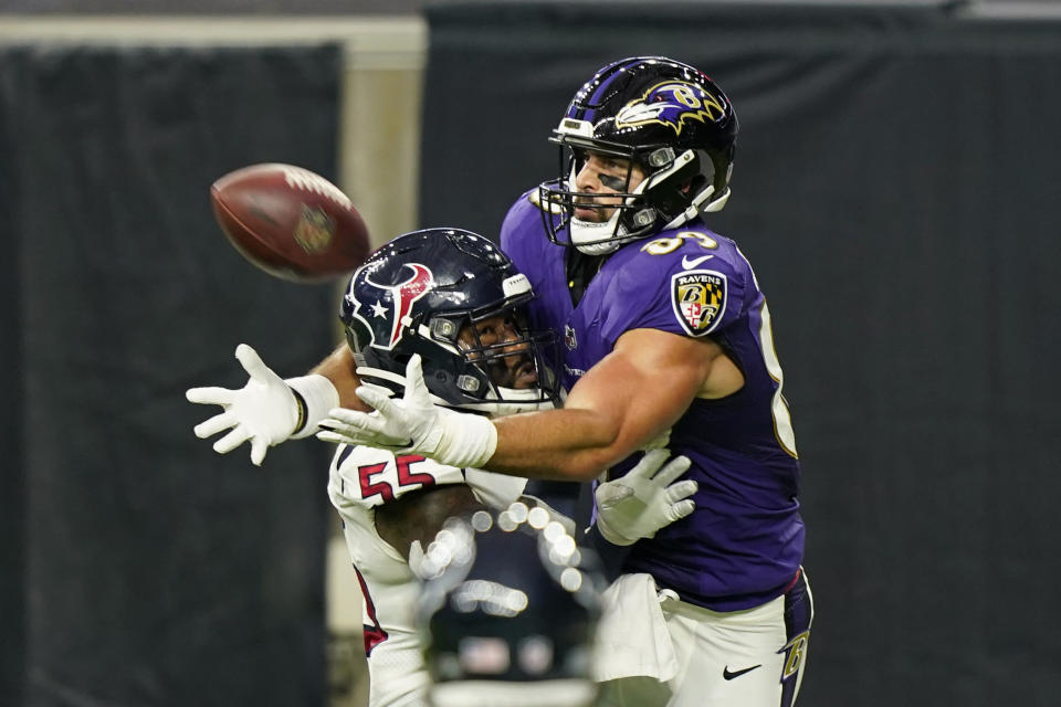 FILE - In this Sept. 20, 2020, file photo, Houston Texans inside linebacker Benardrick McKinney (55) breaks up a pass intended for Baltimore Ravens tight end Mark Andrews (89) during the second half of an NFL football game in Houston. The photo was part of a series of images by photographer David J. Phillip which won the Thomas V. diLustro best portfolio award for 2020 given out by the Associated Press Sports Editors during their annual winter meeting. (AP Photo/David J. Phillip, File)