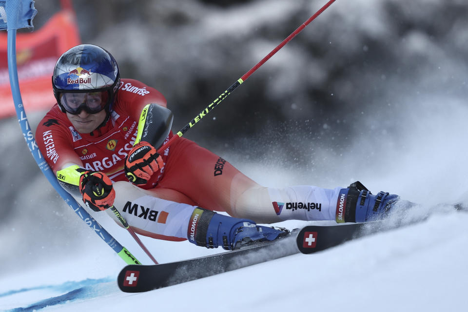 Switzerland's Marco Odermatt speeds down the course during an alpine ski, men's World Cup giant slalom, in Alta Badia, Italy, Sunday, Dec. 18, 2022. (AP Photo/Gabriele Facciotti)