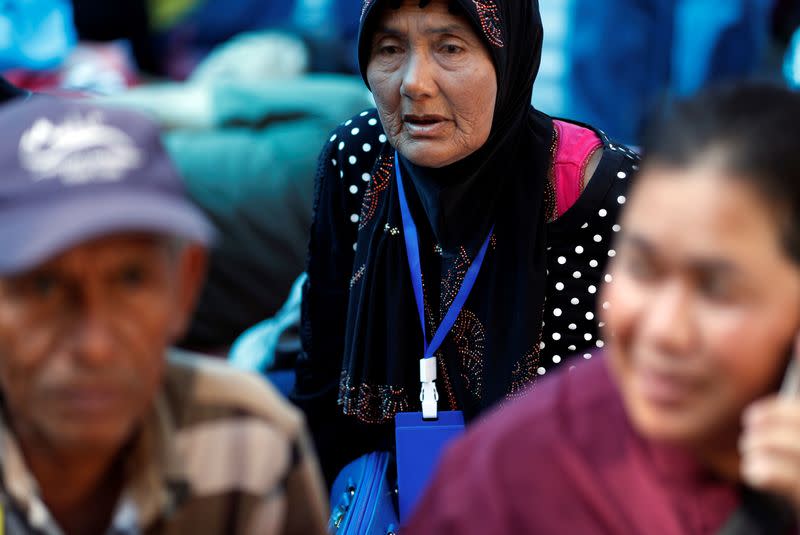 Family members in the fishing industry sit at a protest outside the Agriculture Ministry in Bangkok