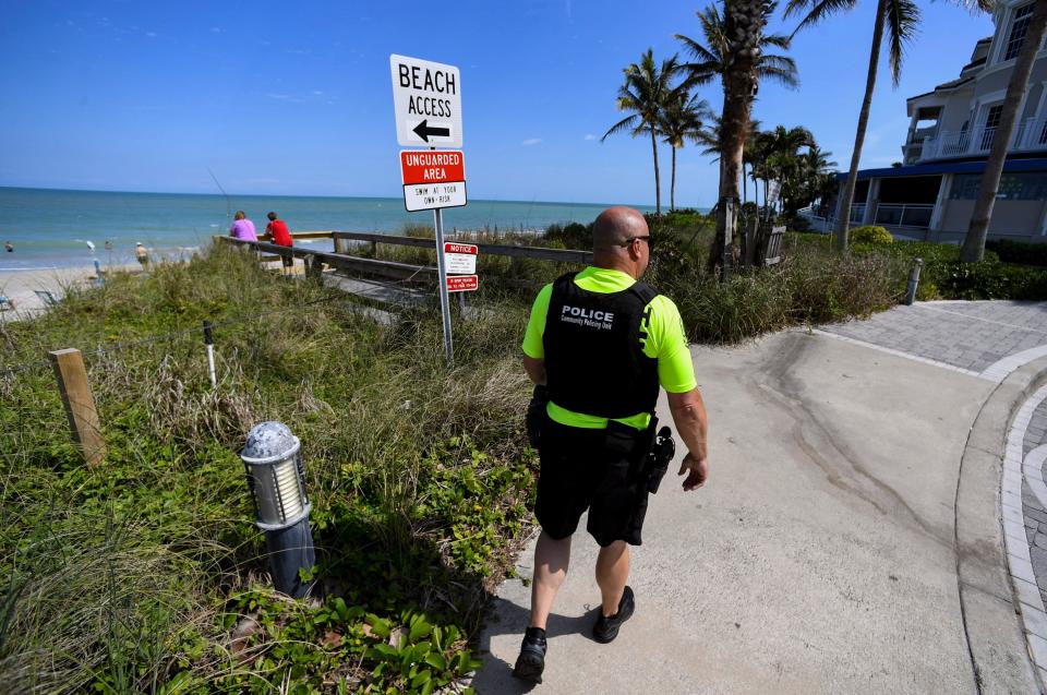 Officer Rich Chimenti, 48, walks south towards Humiston Beach near Ocean Grill during his patrol of the area, March 13, 2024, in Vero Beach. The officer is part of Vero Beach Police Department's newly created Community Partnership Unit. The visible city and police efforts were developed to target gatherings of homeless people in and around Pocahontas Park and to create relationships with business owners in the areas of downtown Vero Beach and beachside along the Ocean Drive area.