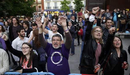 Supporters of Podemos (We can) react at the party's meeting area after the regional and municipal elections in Madrid, Spain, May 24, 2015. REUTERS/Andrea Comas