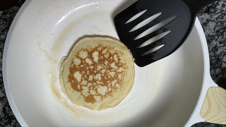 one side of pancake cooked