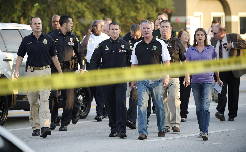 <p>Orlando Mayor Buddy Dyer, center right, and Orlando Police Chief John Mina, center left, arrive to a news conference after a fatal shooting at Pulse Orlando nightclub in Orlando, Fla., June 12, 2016. (AP Photo/Phelan M. Ebenhack) </p>