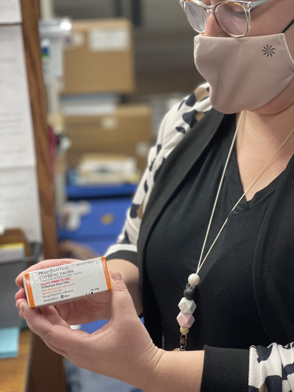 Associate health department director Dr. SarahBeth Hartlage holds Louisville's first doses of the Pfizer COVID-19 vaccine for 5-to-11-year-old children. For appointments, visit nortonchildrens.com.