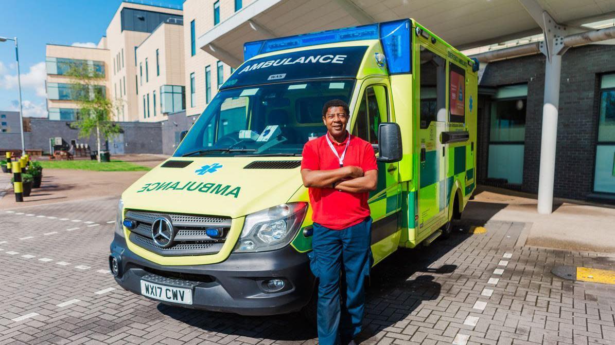 A parademic standing beside an ambulance outside Southmead Hospital's Brunel building
