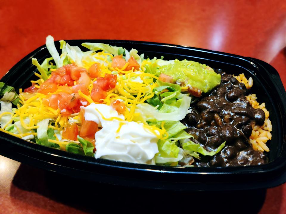 veggie power bowl from taco bell on a red counter