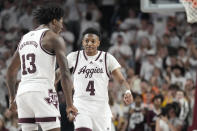 Texas A&M guard Wade Taylor IV (4) reacts with teammate Texas A&M forward Solomon Washington (13) after an out of bounds ball was called for A&M during the second half of an NCAA college basketball game against Alabama, Saturday, March 4, 2023, in College Station, Texas. (AP Photo/Sam Craft)