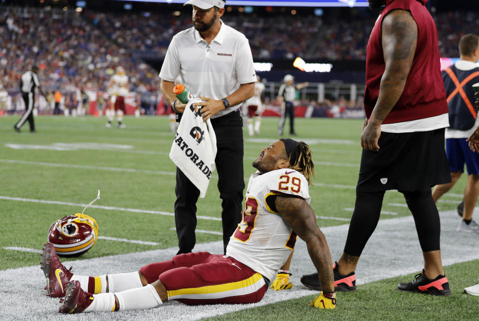 FOXBOROUGH, MA - AUGUST 09: Washington Redskins running back Derrius Guice (29) winces in pain during a preseason NFL game between the New England Patriots and the Washington Redskins on August 9, 2018, at Gillette Stadium in Foxborough, Massachusetts. The Patriots defeated the Redskins 26-17. (Photo by Fred Kfoury III/Icon Sportswire via Getty Images)