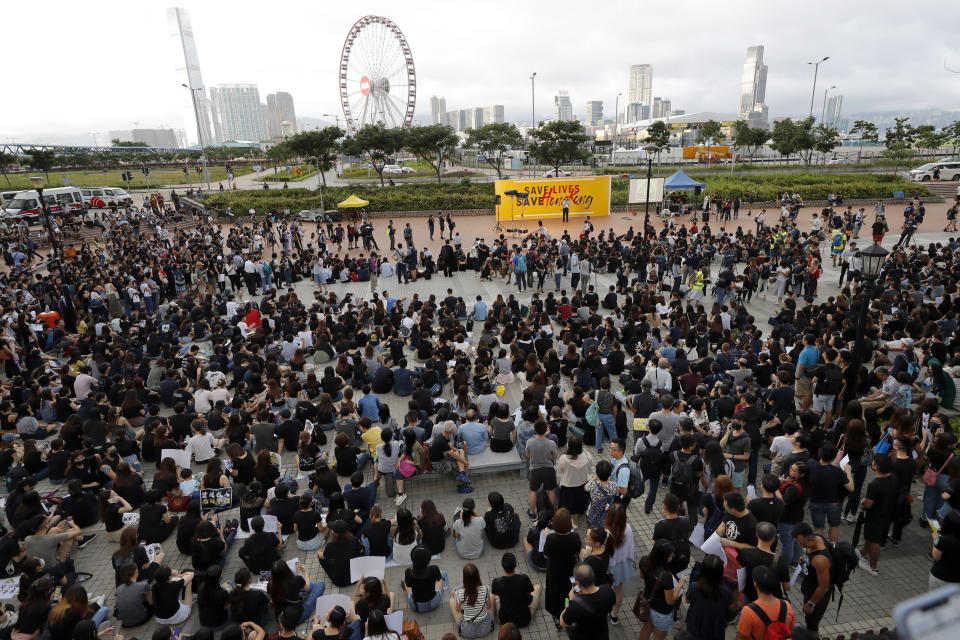 Workers from a medical and health care sector take part in a demonstration in Hong Kong Friday, Aug. 2, 2019. Protesters plan to return to the streets again this weekend, angered by the government's refusal to answer their demands, violent tactics used by police - possibly in coordination with organized crime figures. (AP Photo/Vincent Thian)